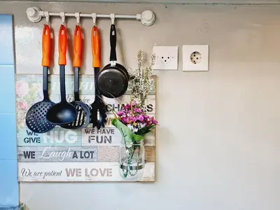 a group of utensils hanging on a wall at Feels Like Home 1 in Athens