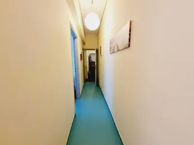 a corridor in a hospital with a long hallway at Feels Like Home 1 in Athens