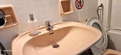 a bathroom with a sink and a toilet at Feels Like Home 1 in Athens