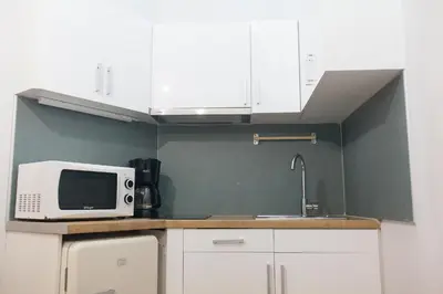 a kitchen with a sink and a microwave at Athens City Themis 2 in Athens