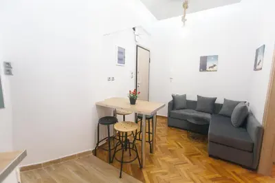 a living room with a couch and a table at Athens City Themis 2 in Athens