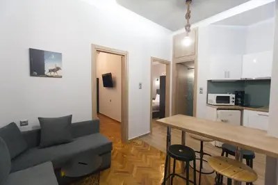 a living room with a couch and a table at Athens City Themis 2 in Athens