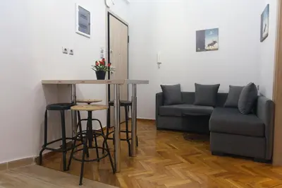 a living room with a couch and a table at Athens City Themis 2 in Athens