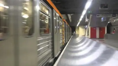 a subway train is pulling into a subway station at Athens central apartment in Athens