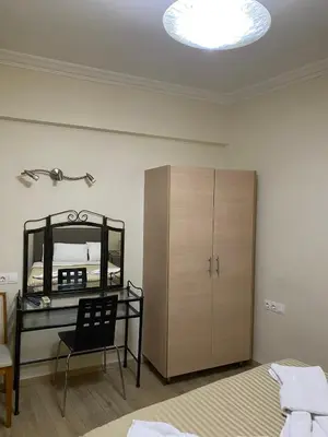 a bedroom with a desk and a bed and a mirror at Athens central apartment in Athens