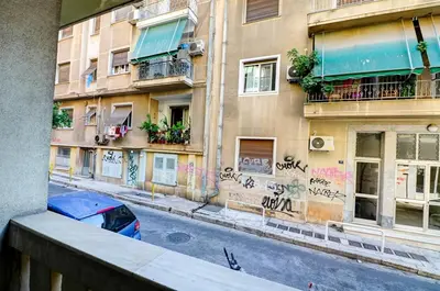 a building with graffiti on the side of a street at Victoria Jewels in Athens