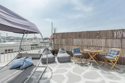 a patio with chairs and a table on a balcony at Island in the sky! Acropolis and city views! in Athens