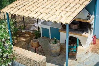 an overhead view of a house with a roof at Marianna Cottage in Palaiá Fókaia