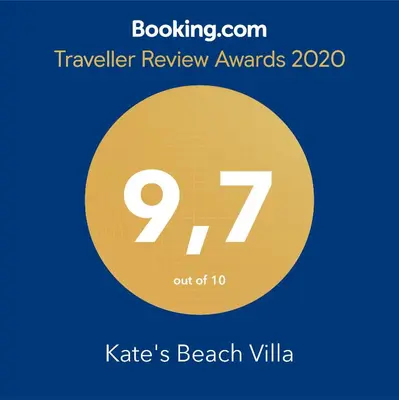 a yellow circle with the number seven and the text travelling review awards at Kate's Beach Villa in Porto Rafti