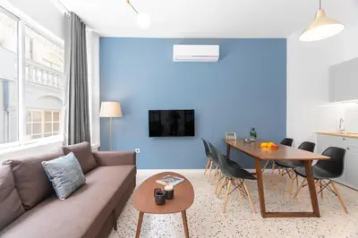 a living room with a couch and a table at Downtown Boutique Apartments Acropolis View in Athens