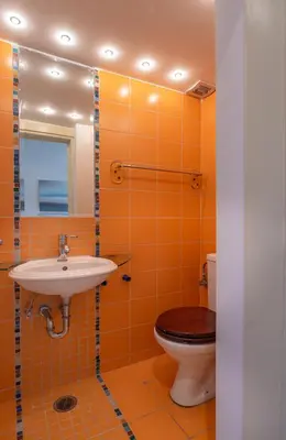 a bathroom with a sink and a toilet at Rhea - Glyfada Sea View apartment in Athens