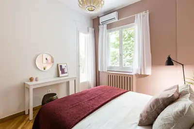 a bedroom with a bed and a window at Classy & Charming 1BD Apartment in Kolonaki by UPSTREET in Athens