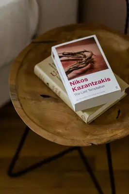 two books sitting on top of a wooden table at Classy & Charming 1BD Apartment in Kolonaki by UPSTREET in Athens