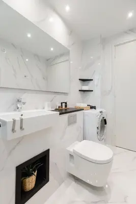 a white bathroom with a toilet and a sink at Classy & Charming 1BD Apartment in Kolonaki by UPSTREET in Athens