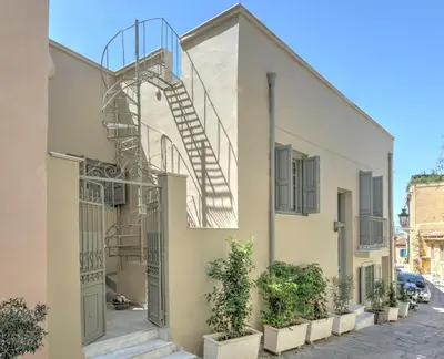 a staircase on the side of a building with plants at Stylish and cozy house in Athens, Plaka in Athens