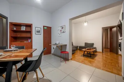 a kitchen and living room with a table and chairs at Athens Near Acropolis in Athens