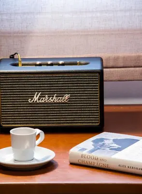 a radio and a cup of coffee and a book at Unique Semi-Basement Stay at the Foot of the Acropolis in Athens
