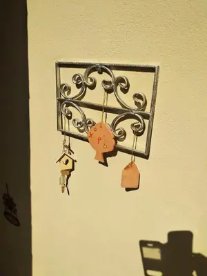 a metal holder with locks on a wall at Artemis GreenHill in Vravrona