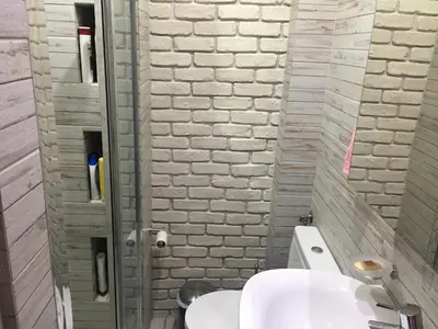 a bathroom with a white toilet and a sink at Cosy and comfort flat, heart of Athens in Athens