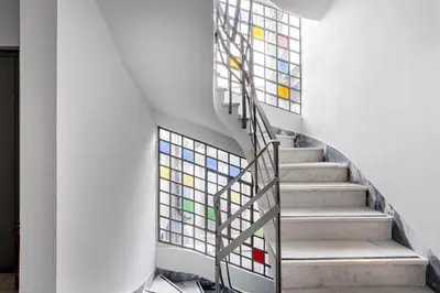 a staircase with stained glass windows at Supreme C2 Apartment in Syntagma in Athens