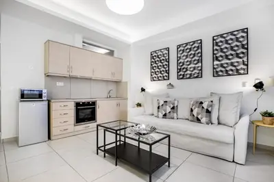a living room with a couch and a table at Supreme B1 Apartment in Syntagma in Athens