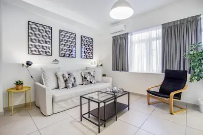 a living room with a couch and a table at Supreme B1 Apartment in Syntagma in Athens