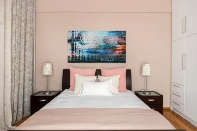 a bedroom with a bed with pink and white pillows at Acropolis Stylish Suite in Athens