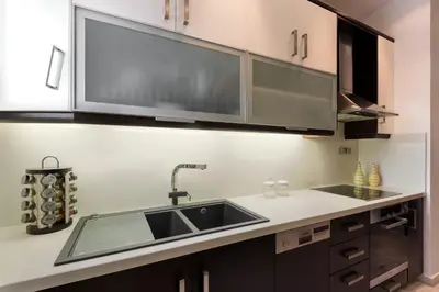 a kitchen with a sink and a counter at Acropolis Stylish Suite in Athens