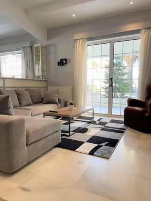 a living room with a couch and a table at Aggelikis House in Spáta