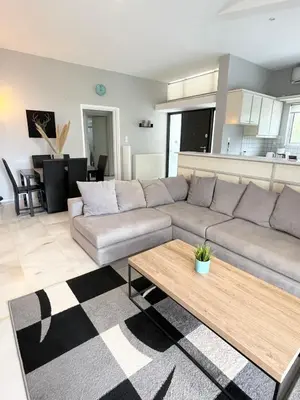 a living room with a couch and a coffee table at Aggelikis House in Spáta