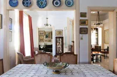 a dining room with a table and plates on the wall at Plaka Vintage in Athens