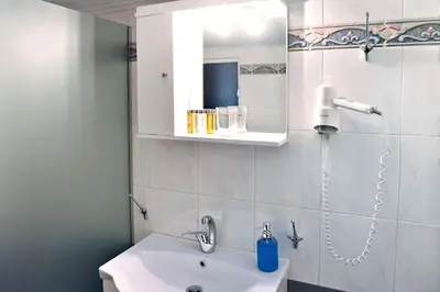 a bathroom with a sink and a mirror at Pnyka Apartment 1 in Athens