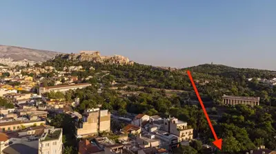 an aerial view of a city with a red arrow at Monastiraki #WallsFree CityCenter- Unspoiled Athens Apartments in Athens