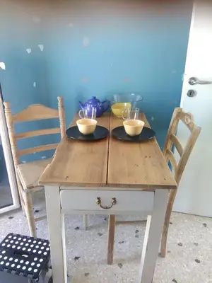 a wooden table with two bowls on top of it at Mia's Atelier, Balcony to Acropolis in Athens