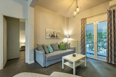 a living room with a couch and a table at Ruby ' s Best Acropolis Apartment in Athens