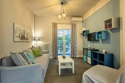 a living room with a couch and a table at Ruby ' s Best Acropolis Apartment in Athens