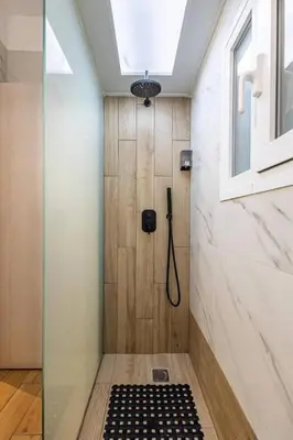 a shower with a glass door in a bathroom at Ruby ' s Best Acropolis Apartment in Athens