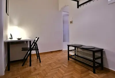 a room with a desk and two chairs and a table at Top Koukaki Location 3rd floor 2bdr in Athens
