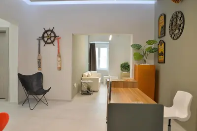 a living room with a table and chairs at Alekos Apartments 2 Netflix, Self Check-In in Athens
