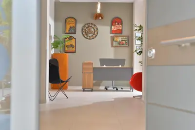 an office with a desk and a computer on a wall at Alekos Apartments 2 Netflix, Self Check-In in Athens