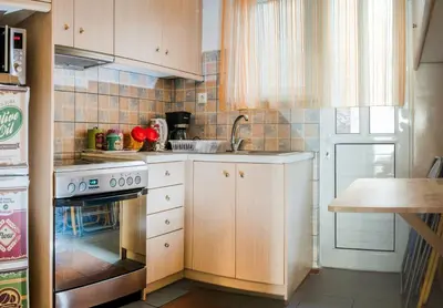 a kitchen with a sink and a stove top oven at Fix Divine Apartment in Athens