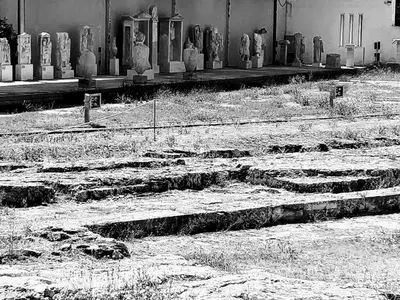 a cemetery with a bunch of statues in front of a building at A Refreshed & Rich in Details Apartment in Piraeus (Passalimani - Marina Zeas) in Piraeus