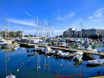 a marina with many boats docked in the water at A Refreshed & Rich in Details Apartment in Piraeus (Passalimani - Marina Zeas) in Piraeus