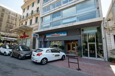 a group of cars parked in front of a building at Athens Center Panoramic Flats in Athens