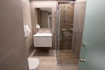 a bathroom with a shower and a toilet and a sink at Athens Center Panoramic Flats in Athens