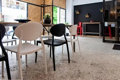 a group of chairs and a table in a room at Piraeus Premium Suites in Piraeus