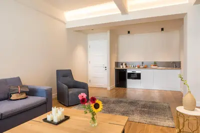 a living room with a couch and a table at Klepsydra Urban Suites in Athens