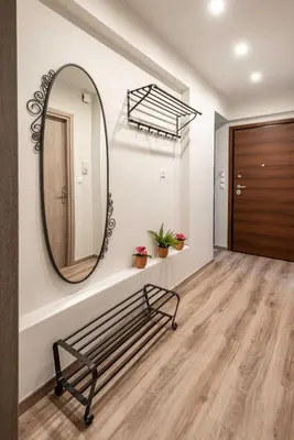 a hallway with a bench and a mirror at Acropolis Koukaki Newly Renovated 55sq.m Apartment in Athens