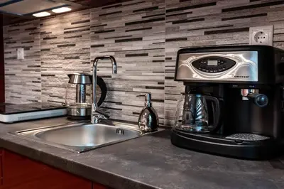 a coffee maker sitting on top of a kitchen sink at Acropolis Koukaki Newly Renovated 55sq.m Apartment in Athens
