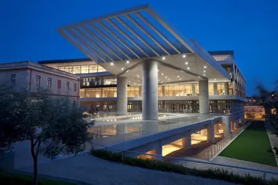 an external view of a building at night at Acropolis Koukaki Newly Renovated 55sq.m Apartment in Athens
